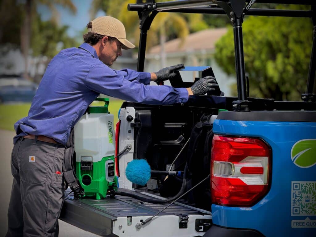 Wise House Technician next to the truck