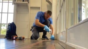 No-tent termite treatment in South Florida technician performing drywood termite spot treatment