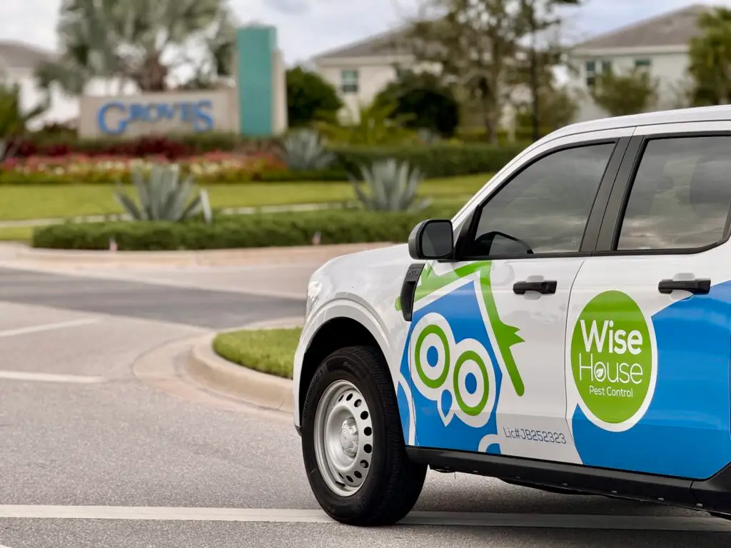 Wise House Pest Control technician vehicle in White City, Florida