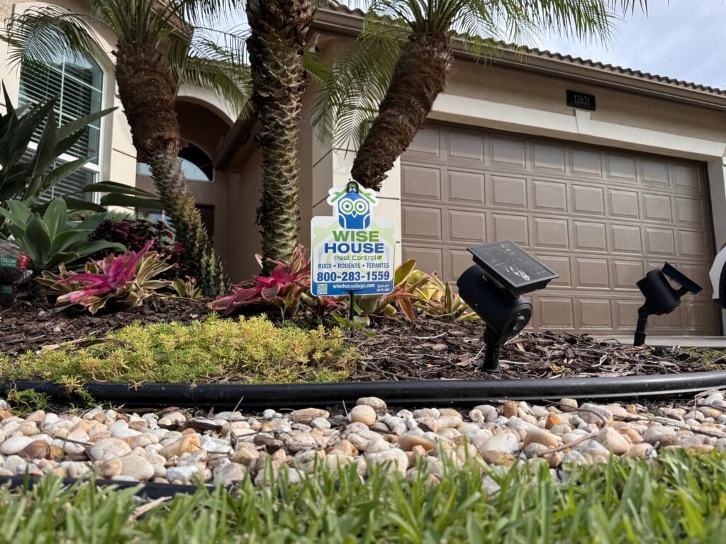 Wise House Pest Control technician applying snake repellent service in West Boynton Beach Florida