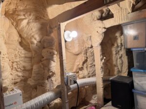 spray foam insulation covering attic roof decking and rafters in a South Florida home